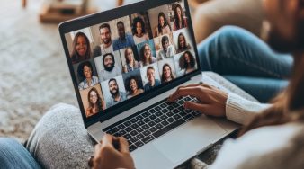 Businesswoman attending online meeting with diverse colleagues using video call on laptop. Generative AI