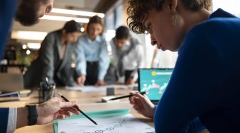 people-analyzing-checking-finance-graphs-office